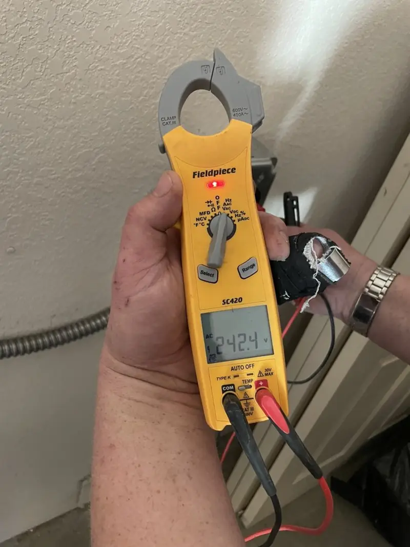 Voltage testing with clamp meter during Ceiling Fan Installation in Montvale